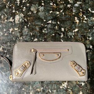 Balenciaga womens zip around wallet. Grey textured with gold hardware.